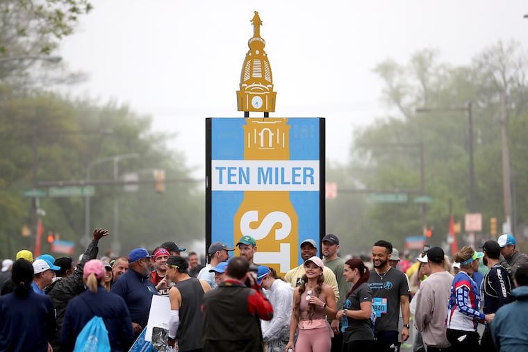 A crowd gathers at the starting line at West Fisher Avenue in North Philadelphia before the Broad Street Run.