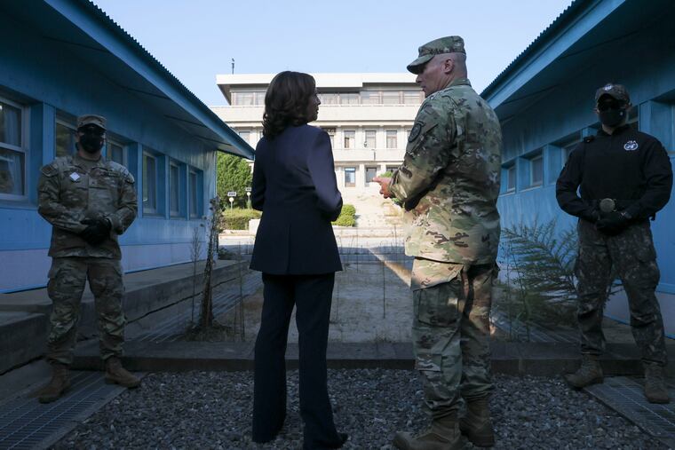 U.S. Vice President Kamala Harris (center left) stands next to the demarcation line at the demilitarized zone (DMZ) separating the two Koreas, in Panmunjom, South Korea, on Thursday.