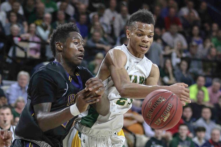 Roman's Allen Betrand tries with Bonner-Prendie's Isaiah Wong for a loose ball during 3rd quarter of the Catholic League Championship at The Palestra, Monday, February 26, 2017. Roman beats Bonner-Prendie 51-49 to win the Catholic League Championship. ( STEVEN M. FALK / Staff Photographer )