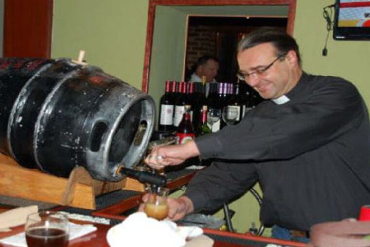 The Rev. Kirk Berlenbach of St. Timothy's Episcopal tapping the first keg of Gingerbread Jesus at Barren Hill Tavern & Brewery in Lafayette Hill.