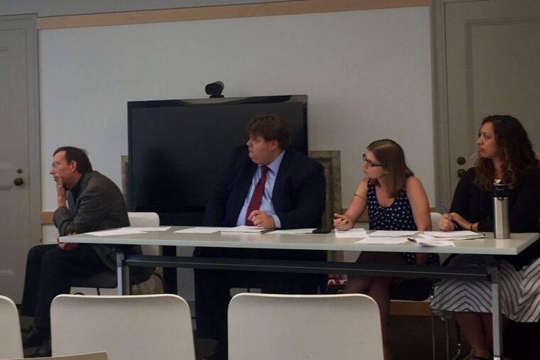Pennsylvania Department of Human Services staff listen to testimony at a public hearing in Philadelphia.