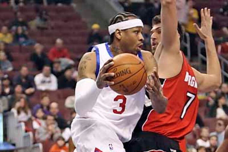 Allen Iverson, playing in his 900th game, looks to pass around Raptors' Andrea Bargnani during the 1st quarter. ( Steven M. Falk / Staff Photographer )