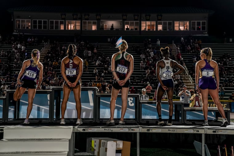 Sadie Schreiner, a transgender sprinter, wears a trans flag in her hair at the 2024 NCAA Division III outdoor track and field championships at Doug Shaw Memorial Stadium in Myrtle Beach, S.C.