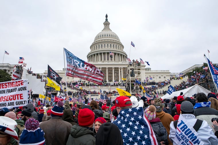Rioters loyal to Donald Trump rally at the U.S. Capitol in Washington on Jan. 6, 2021. Over the weekend, the former president called for the "termination" of the Constitution to overturn the 2020 election.