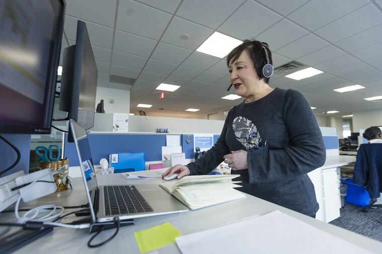 Val Voluntad, shown at work in Patina's Bala Cynwyd office, is a health champion for the company, which is developing a new, hybrid model of primary care for seniors combining home visits and virtual care. Voluntad's job is to be familiar with patients' histories and preferences and manage their care.