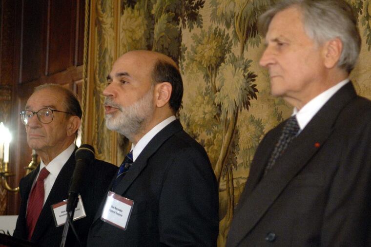 Then-Federal Reserve Chairman Ben Bernanke, center, speaks at the 20th anniversary celebration of the International Economy magazine with former Federal Reserve Chairman Alan Greenspan, left, and then-European Central Bank President Jean-Claude Trichet, right, in October 2007 in Washington. The Great Recession began just two months later. (AP File Photo)