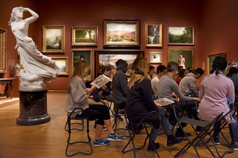 First-year Penn medical students sharpen their observation skills at the Philadelphia Museum of Art, overseen by a marble sculpture, “The Lost Pleiad,” by Randolph Rogers.