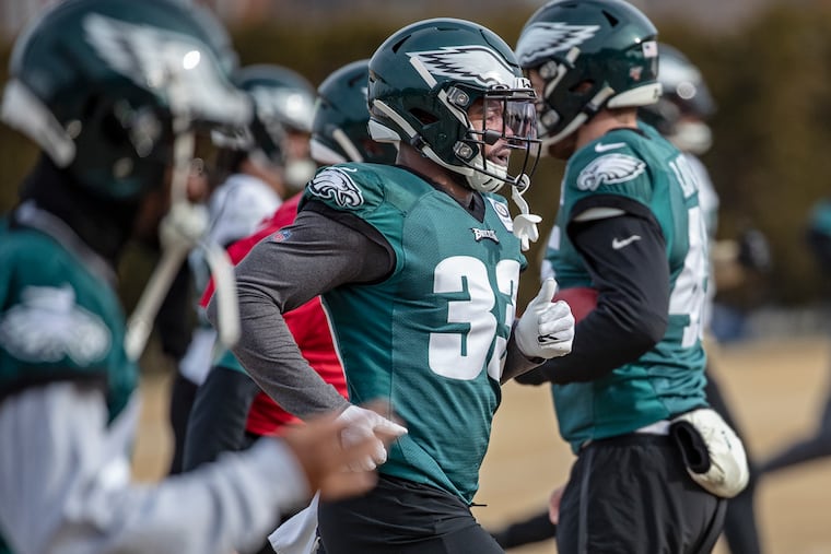 Elijah Holyfield, center, running before an Eagles practice in January.