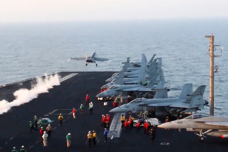 This image taken from video provided by the U.S. Navy shows an aircraft launching from a carrier in an undisclosed location before airstrikes in Sanaa, Yemen, on Saturday.