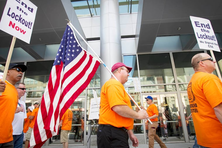 Members of the Metropolitan Regional Council of Carpenters hold a protest rally outside the Pennsylvania Convention Center protest at the entrance at N. Broad St. at Arch on Friday morning July 11, 2014. The Carpenters Local feel unfairly locked out of the convention center. ( ALEJANDRO A. ALVAREZ / STAFF PHOTOGRAPHER )
