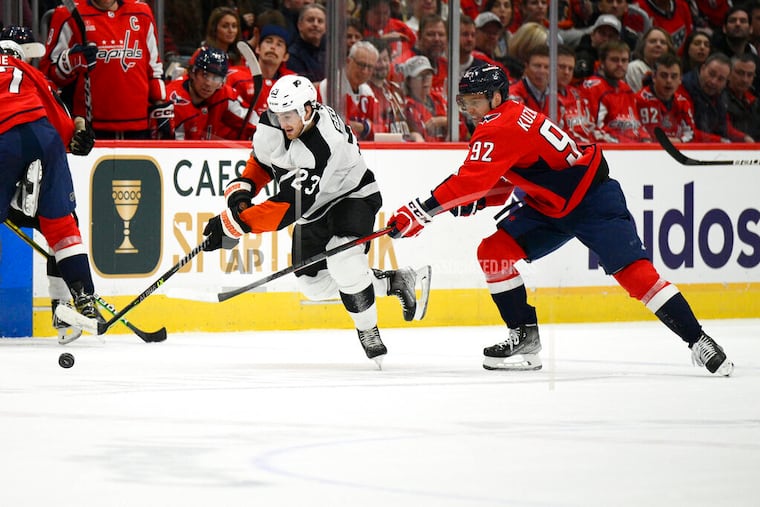 Flyers center Lukáš Sedlák (23) chases the puck in front of Washington Capitals center Evgeny Kuznetsov during the second period on Wednesday.