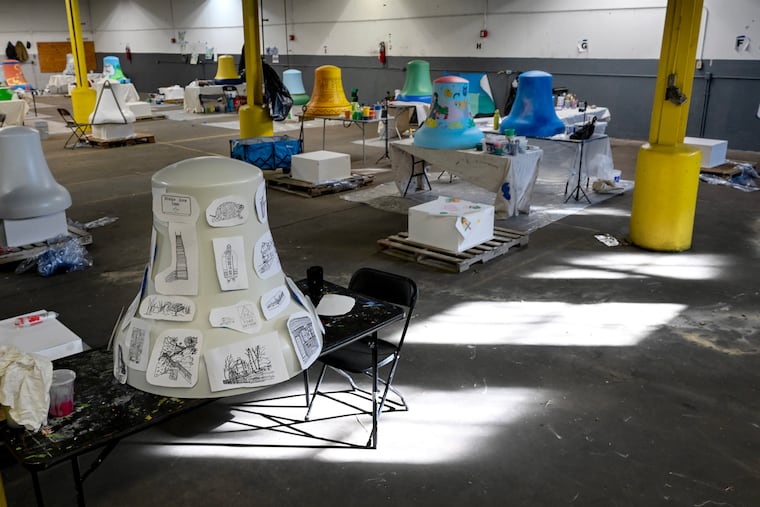 The work of local artists begins on 20 painted replica Liberty Bells representing different neighborhoods Tuesday, Dec. 9, 2025.