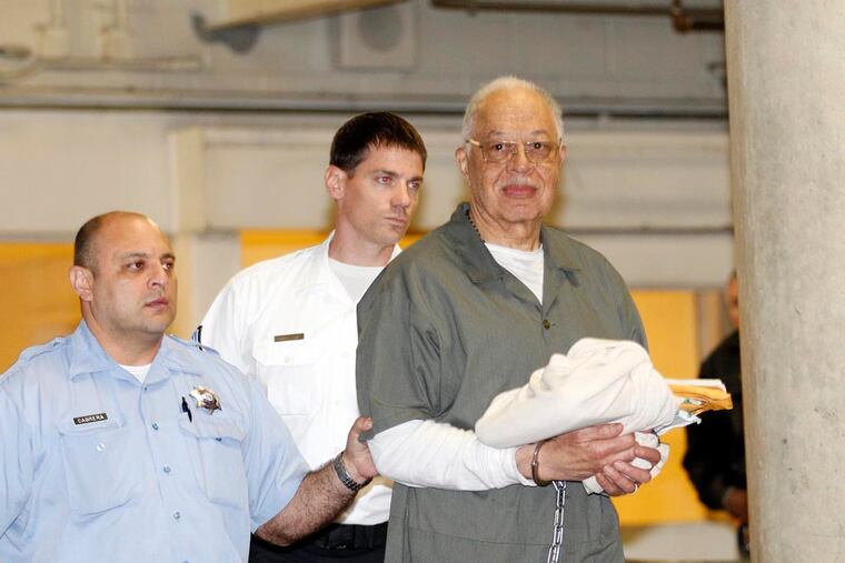 Dr. Kermit Gosnell gets escorted to a van leaving the Criminal Justice Center after getting convicted on three counts of first degree murder on Monday, May 13, 2013.