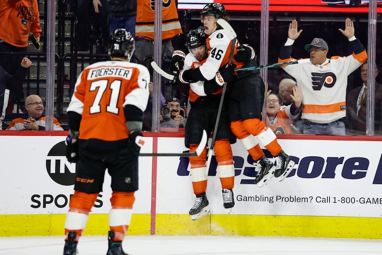 Noah Cates and Trevor Zegras celebrate after Cates scored to give the Flyers a 4-2 lead in the third period.