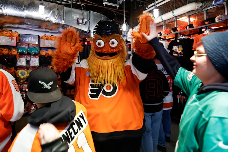 Flyers mascot Gritty greets fans during the grand opening of Gritty’s Chaos Factory at the Wells Fargo Center Monday.