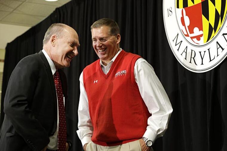 Big Ten Commissioner James Delany, left, speaks with Maryland football
coach Randy Edsall after a news conference that was held to announce
Maryland's decision to move to the Big Ten in College Park, Md.,
Monday, Nov. 19, 2012. Maryland is joining the Big Ten, leaving the
Atlantic Coast Conference in a shocker of a move in the world of
conference realignment that was driven by the school's budget woes.
(AP Photo/Patrick Semansky)