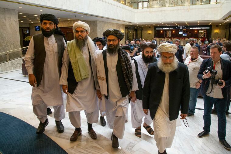 In this May 28, 2019 file photo, Mullah Abdul Ghani Baradar, the Taliban group's top political leader, third from left, arrives with other members of the Taliban delegation for talks in Moscow, Russia. U.S. envoy Zalmay Khalilzad and the Taliban have resumed negotiations on ending America’s longest war. A Taliban member said Khalilzad also had a one-on-one meeting on Wednesday, Aug. 21, 2019, with Baradar, the Taliban’s lead negotiator, in Qatar, where the insurgent group has a political office.