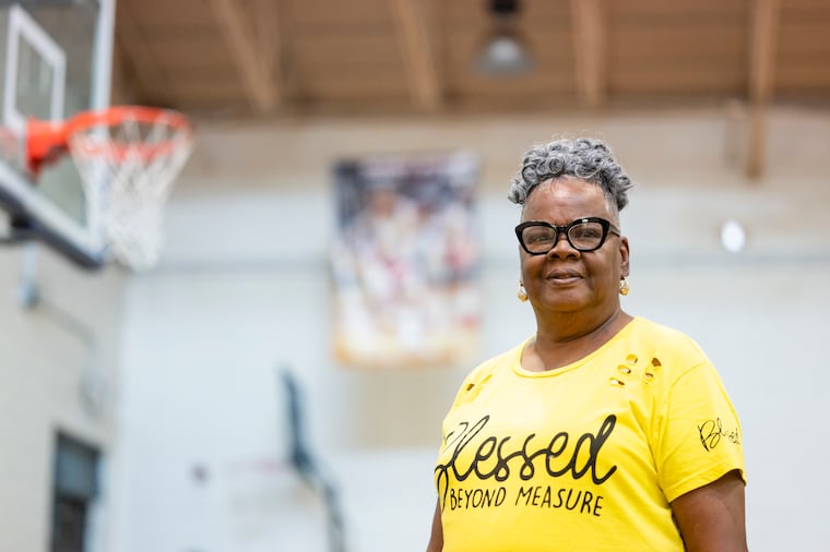 Viola “Candy” Owens stands for a portrait on the basketball court inside the Rumph-Mallery Recreation Center last summer.