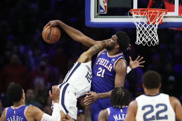 Sixers center Joel Embiid blocks Memphis Grizzlies guard Ja Morant’s shot attempt during the fourth quarter on Thursday.