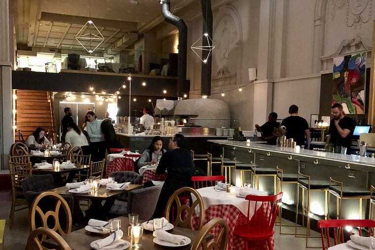 Porta, at 1214-16 Chestnut St., set for dinner in January 2018, shortly after its opening. Later at night, the restaurant and its adjoining barroom were crowded with revelers.
