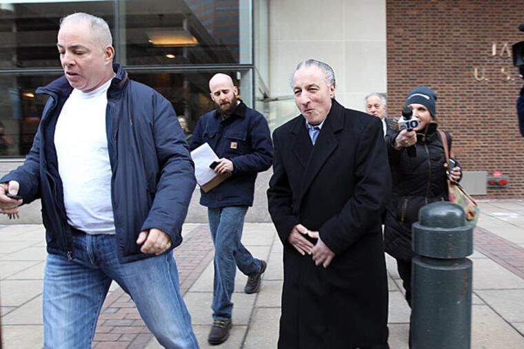 Joseph Ligambi (center) smiles as he exits the federal courthouse yesterday. He’s been locked up the past 32 months. (David Maialetti/Staff)