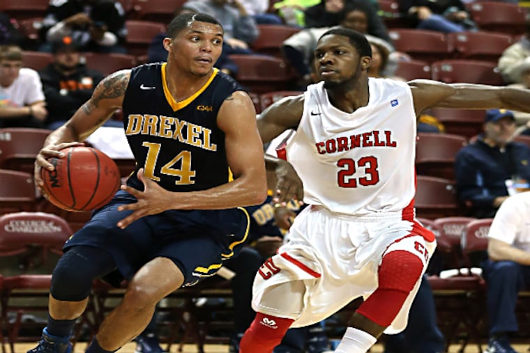 Drexel guard Damion Lee dribbles to the basket with pressure from Cornell Big Red guard Galal Cancer. (Jim Dedmon/USA TODAY Sports)