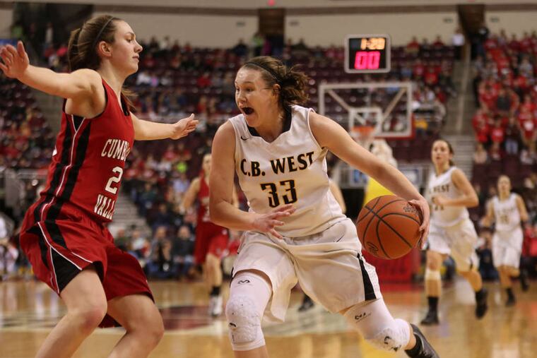 Central Bucks West's Nicole Munger is guarded by Cumberland Valley's Kelly Jekot as she drives to the basket in the state final. Munger finished with nine points Friday in her last game for the Bucks. Jekot scored 3 points for the winners.
