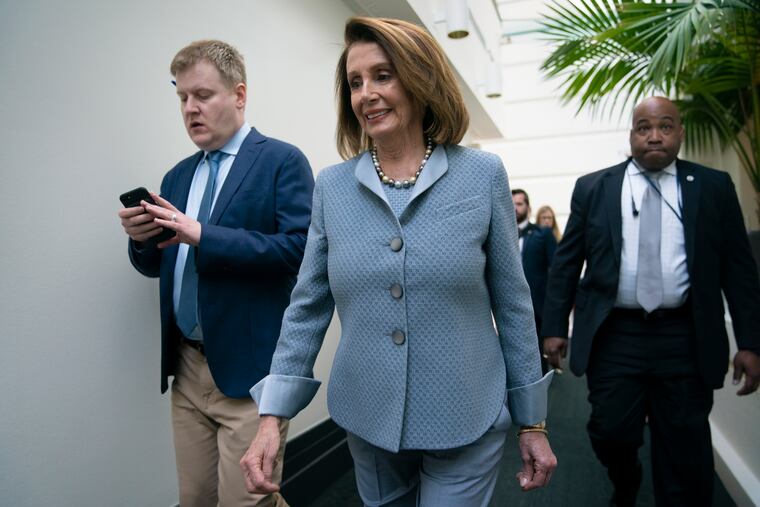 House Speaker Nancy Pelosi, D-Calif., walks to a Democratic Caucus meeting at the Capitol Tuesday, hours before she and leading House Democrats unveiled legislation to shore up the Affordable Care Act.