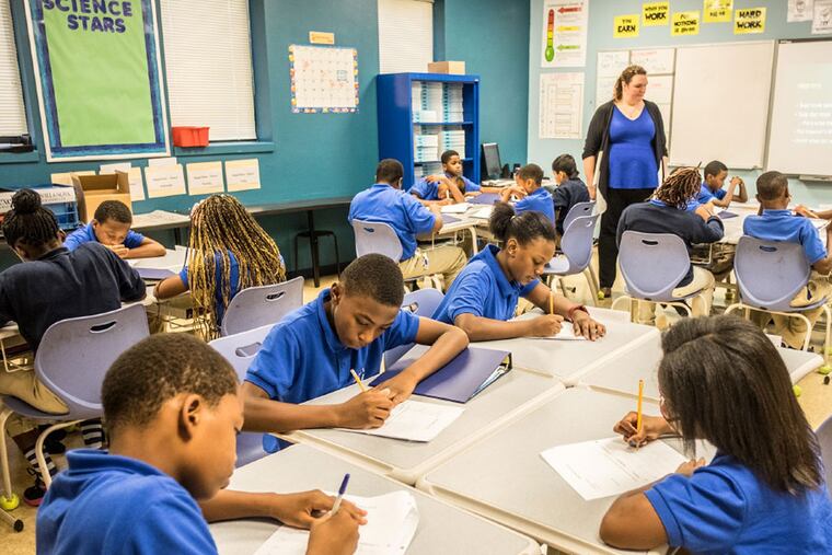 Sixth graders work on their studies at Young Scholars Charter School, the city's top-ranked middle school. ( ED HILLE / Staff Photographer )