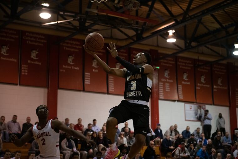 Neumann Goretti's Hakim Byrd with two of his 26 points in a 65-62 win over Archbishop Carroll on Monday night.