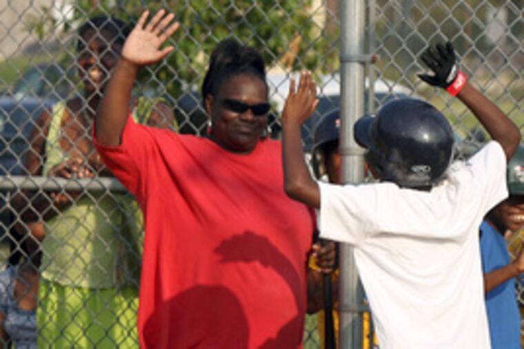 Shakur Brags celebrates his two-run homer with Daphne Goggins.