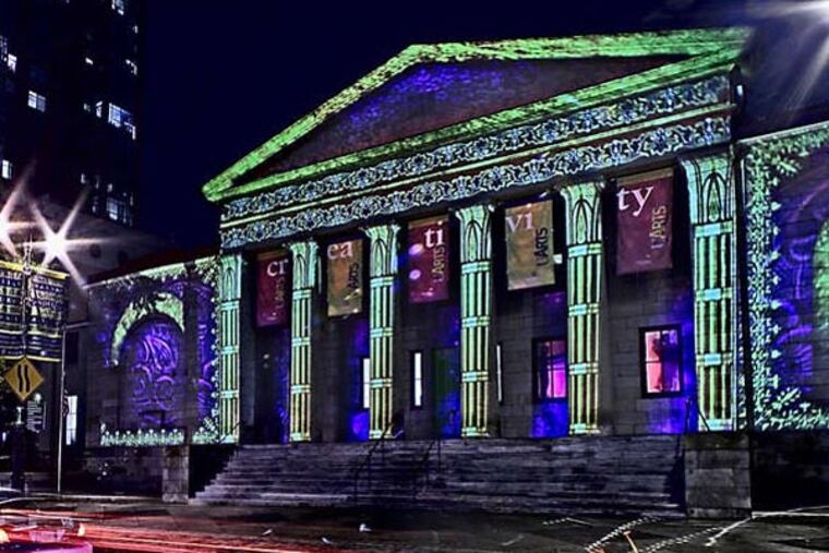 The University of the Arts' Dorrance Hamilton Hall at Broad and Pine Sts.. illuminated by a projection created by Artlumiere. View is facing west. Time exposure results in vehicle's lights leaving trails on Broad street. (David M Warren/Inquirer) EDITORS NOTE: PLIGHT23Pi 98240 PHILADELPHIA 11/20/07 Last year the Center City District sponsored a holiday lighting program that bathed City Hall in changing pastel shades. This year, the district is moving the show to South Broad on the Avenue of the Arts with a difference: the display will use differently types of lighting technology and the public will be urged to vote on which they like best. 9/