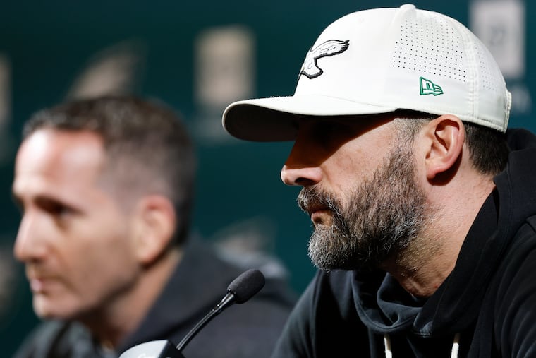 Eagles coach Nick Sirianni (right) and general manager Howie Roseman have no shortage of viable offensive coordinator candidates.