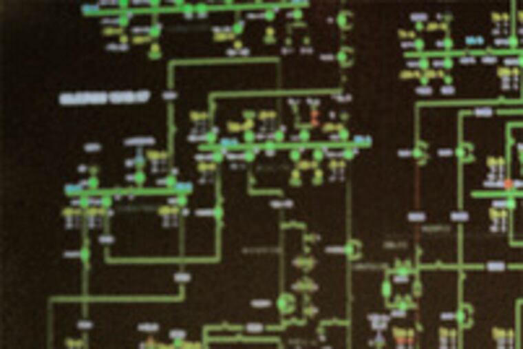 Dave Kimmerle, at Peco's monitoring site in Plymouth Meeting. A computerized schematic shows the five-county power system.