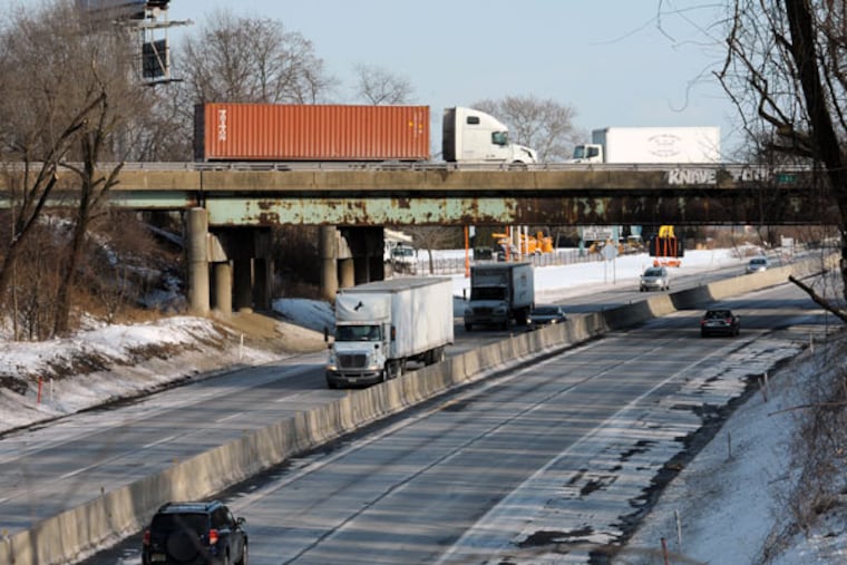 Interstate 95 crosses over the Pennsylvania Turnpike near Levittown. ( CLEM MURRAY / Staff Photographer )
