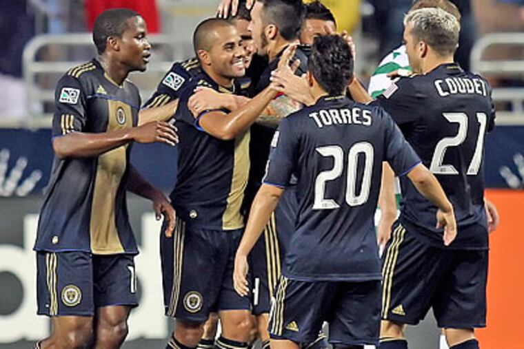 Eduardo Coudet (right) got his first game action for the Union during the first half. (Steven M. Falk/Staff Photographer)
