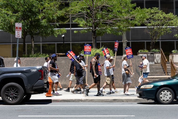 Members of IBEW Local 614 picket outside of the Peco headquarters on Saturday, July 4, 2026, in Philadelphia.