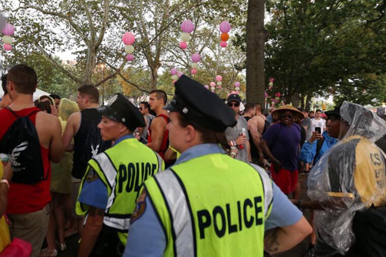 Philadelphia police officers at the Made in America music festival on the Ben Franklin Parkway in 2014. (David Maialetti/Staff photographer)
