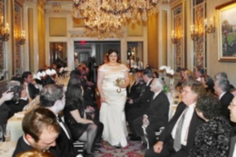 The bride wears the white silk dress chosen by her mother before she died of breast cancer.