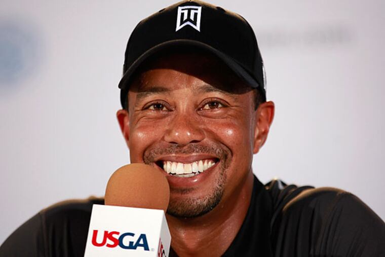 Tiger Woods smiles as he talks with reporters Tuesday afternoon ahead of the U.S. Open at Merion. (David Swanson/Staff Photographer)