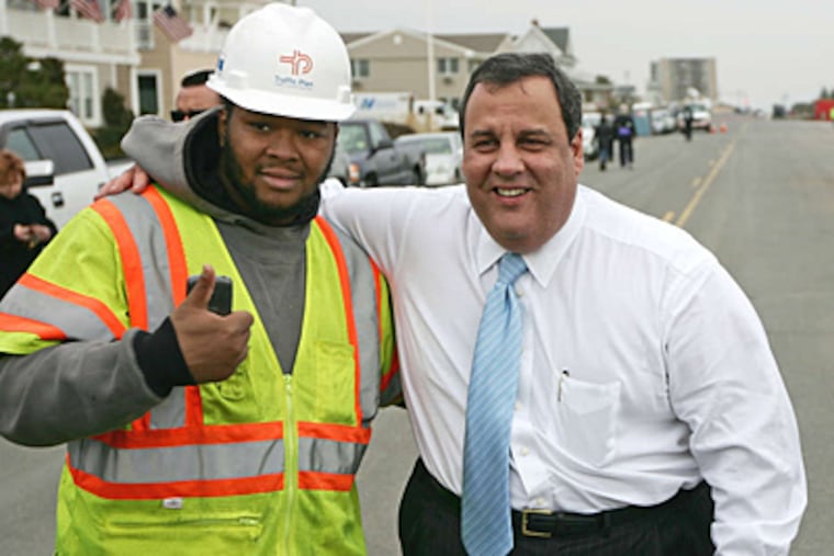 Gov. Christie with Traffic Plan employee Ryan Hart last week as workto restore Belmar's boardwork began. Storm recovery will be a key focus for Corbett amid the campaign.