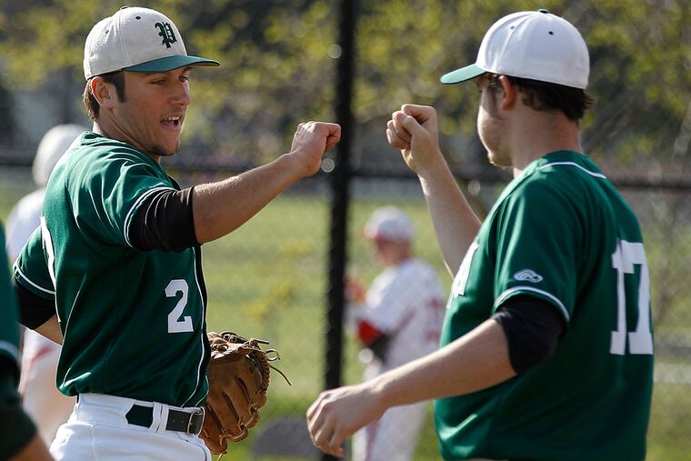 Pennridge's Dan Long (left), who came on in relief, is congratulated by starting pitcher Nate Coyle.