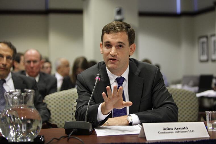 John Arnold, a Texas billionaire and former hedge fund executive, testifies in Washington in 2009. He is bankrolling a super PAC that is running ads in the New Jersey Senate race.