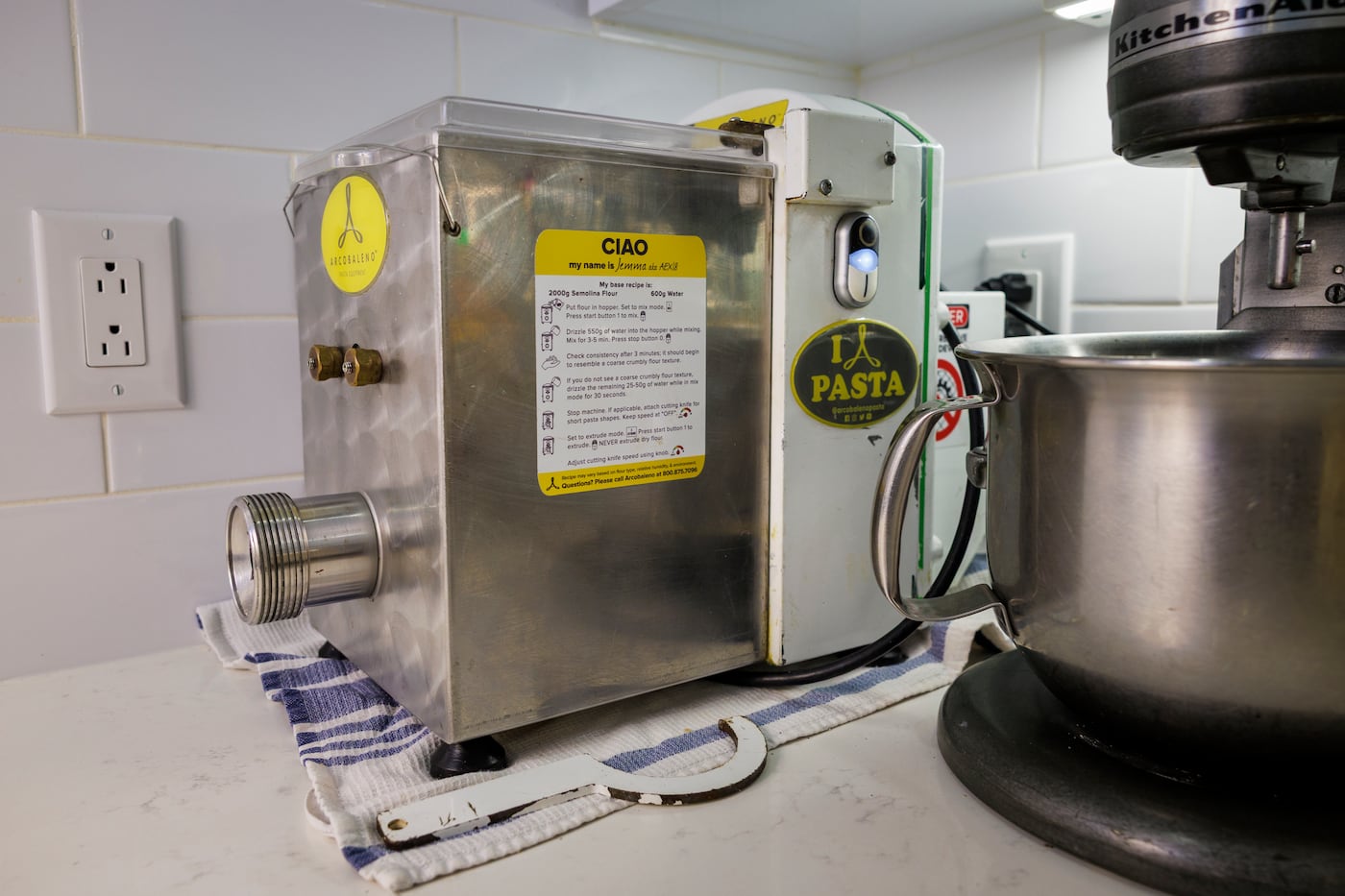 The pasta machine, made in Lancaster, sits prominently displayed in the corner, waiting for the next time the family makes fresh noodles.