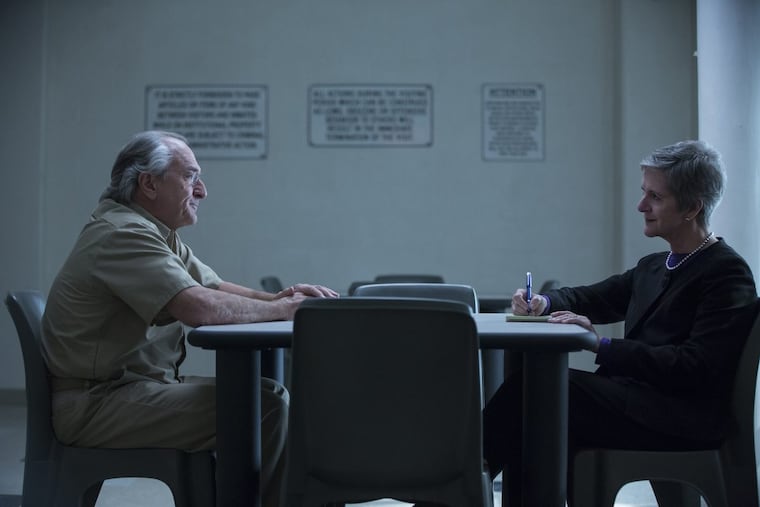 Robert De Niro as Ponzi schemer Bernard Madoff and journalist Diana B. Henriques, playing herself, face off in HBO’s “The Wizard of Lies,” based on Henriques’ best-selling book