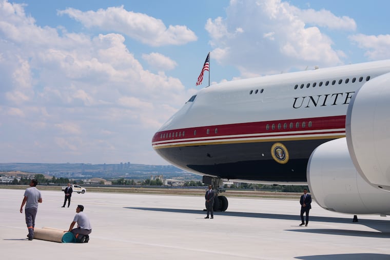 Staff lay a carpet on the tarmac before President Donald Trump exits Air Force One upon arriving for the NATO summit in Ankara, Turkey, Tuesday, July 7, 2026. The New York Times reported Wednesday that there were security concerns about the refurbished jet. On Friday the administration subpoenaed the reporters.