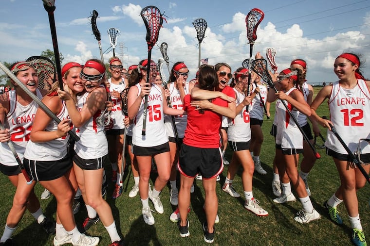 Lenape celebrate their 10-7 win against Shawnee for the South Jersey Group 4 final in girls' lacrosse in Medford, New Jersey, Wednesday, May 27, 2015. ( Steven M. Falk / Staff Photographer )