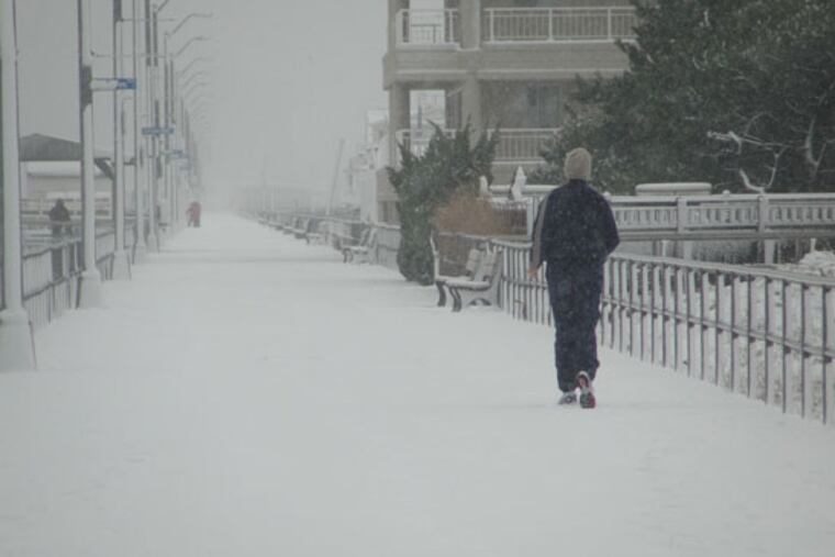 A jogger runs through the snow in Ventor, NJ., in this file photo.