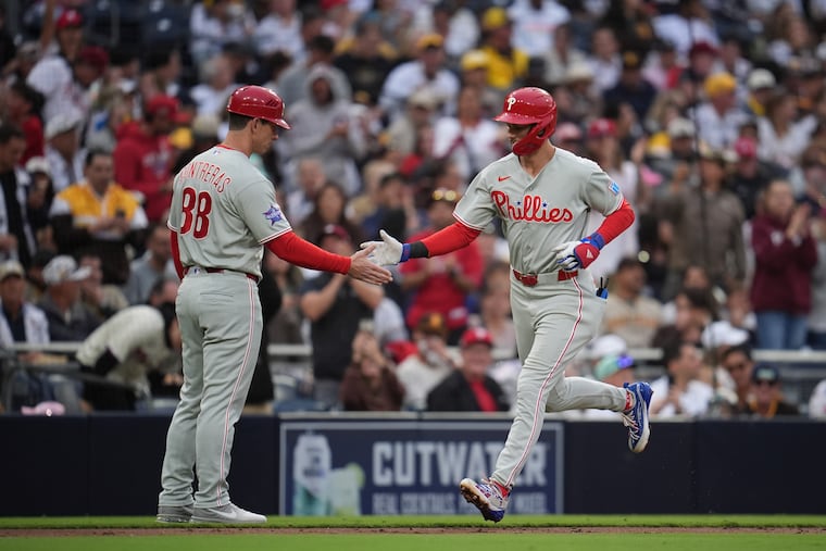 Trea Turner (right) celebrates his third inning solo homer.