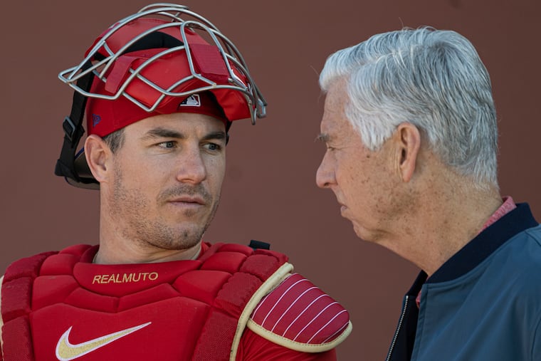 Phillies catcher J.T. Realmuto (left) and president of baseball operations Dave Dombrowski eventually came to an agreement on the catcher's value last month.